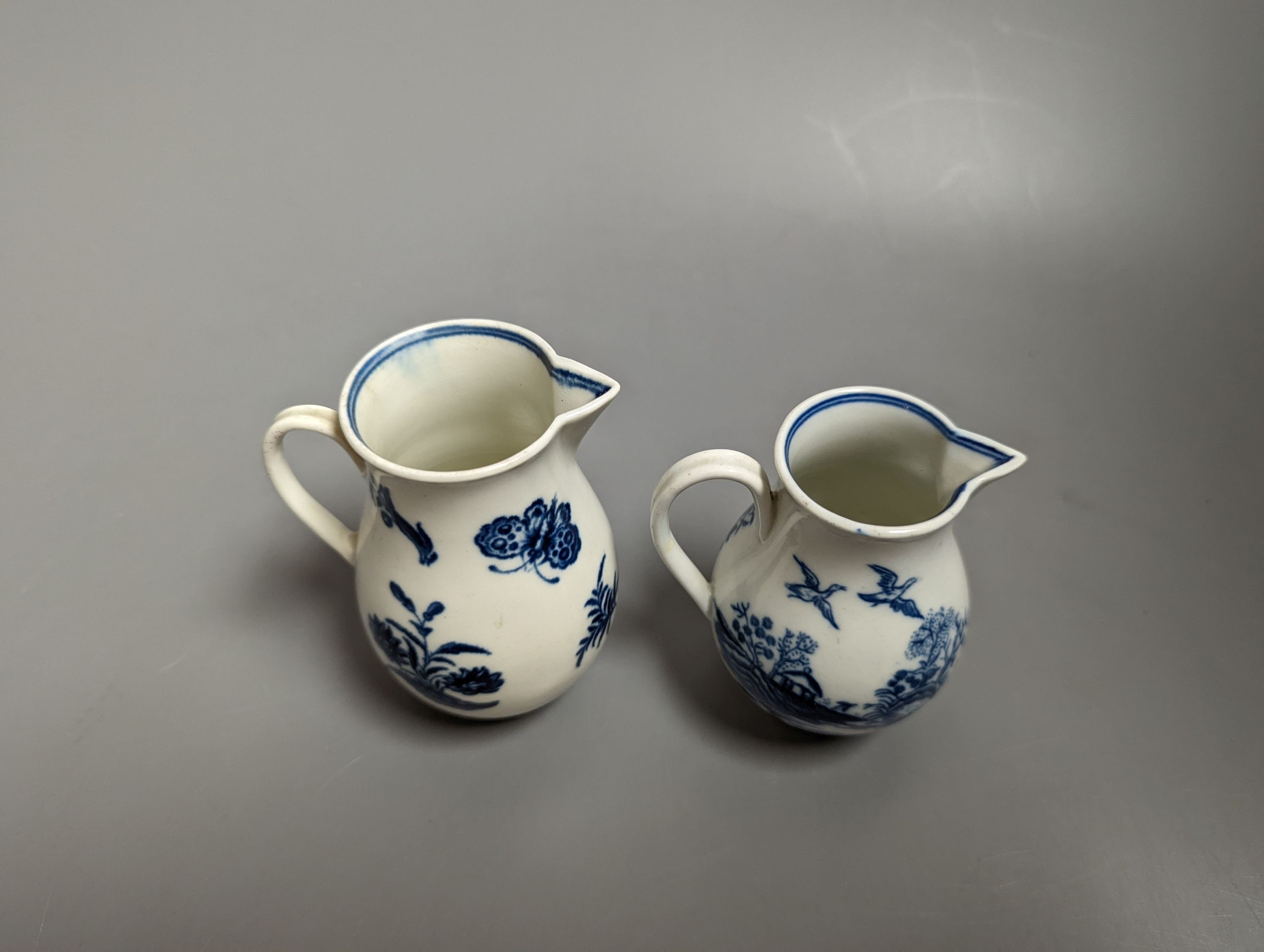 A Caughley sparrowbeak jug printed with the Three Flowers pattern and another printed with the Fence pattern, S marks